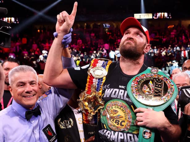 Tyson Fury celebrates his 11th round knock out win against Deontay Wilder after their WBC heavyweight title fight at T-Mobile Arena on October 09, 2021 in Las Vegas, Nevada.