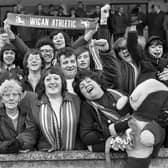 Wigan Athletic fans cheer on their team against Runcorn in a Northern Premier League match at Springfield Park on Saturday 30th of December 1972.
Latics won 3-0 with Micky Worswick, Graham Oates and John Rogers scoring the goals.