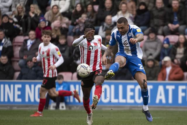 Josh Magennis gets a shot away against Sunderland