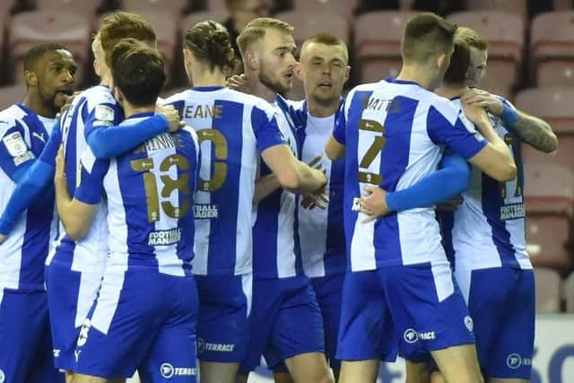 The Latics side celebrate against Fleetwood