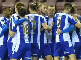 The Latics side celebrate against Fleetwood