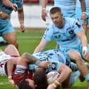 Wigan's Ollie Partington crosses for a try against Wakefield