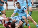 Wigan's Ollie Partington crosses for a try against Wakefield