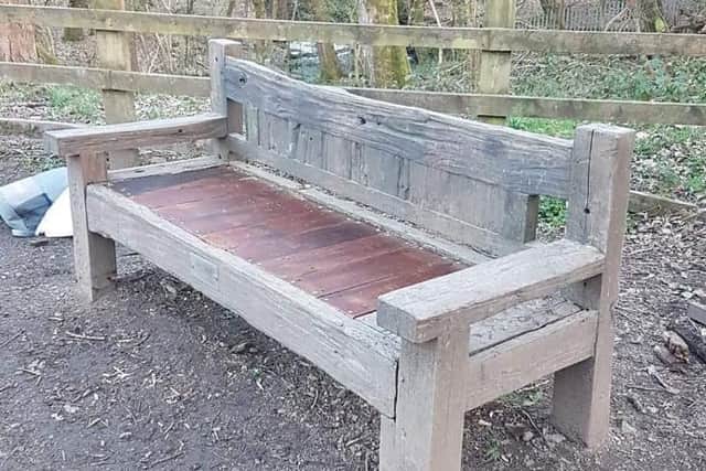 A stranger repaired the bench, using different wood