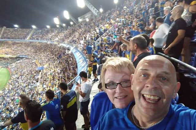 Linda and David at a Boca Juniors match during one of their holidays