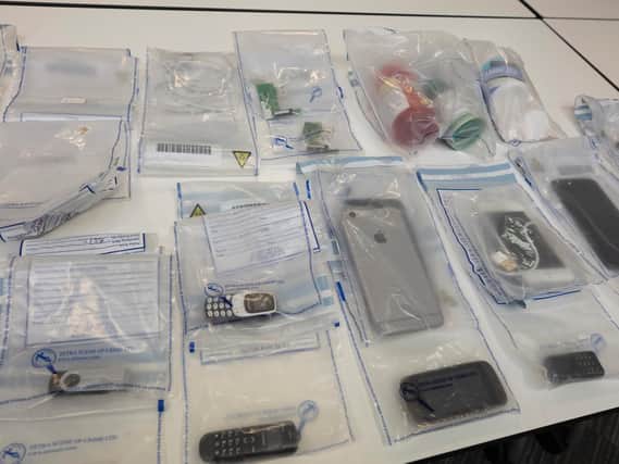 Items seized by police (Image: GMP)