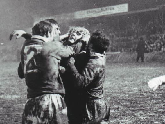 Cliff Hill is mobbed by Bill Francis, Geoff Lyon and Johnny Jackson after scoring a vital try against St Helens at Central Park in 1968