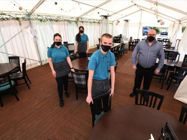 Staff, from left, Ciara Tordoff, Zara McKenna, Charlie Anderson and Mathew Willis, are ready to welcome customers to their marquee beer garden at The Crown, Worthington