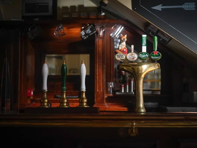 Beer pumps sit dormant in a pub during the pandemic lockdown in March.