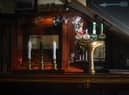 Beer pumps sit dormant in a pub during the pandemic lockdown in March.