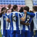 The Latics players celebrate beating Sunderland in midweek