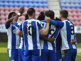 The Latics players celebrate beating Sunderland in midweek