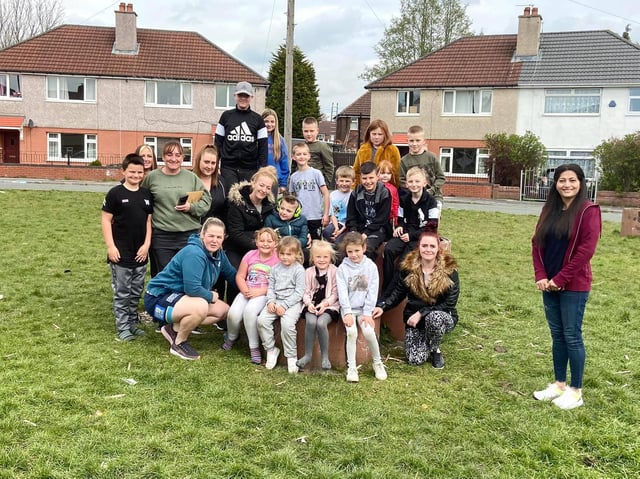 Coun Nazia Rehman with children and parents on the green space in Rutland Road, Tyldesley
