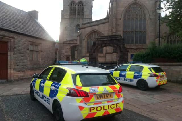 Police outside Wigan Parish Church after the incident last August