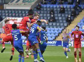 Will Keane heads home the opening goal at Shrewsbury