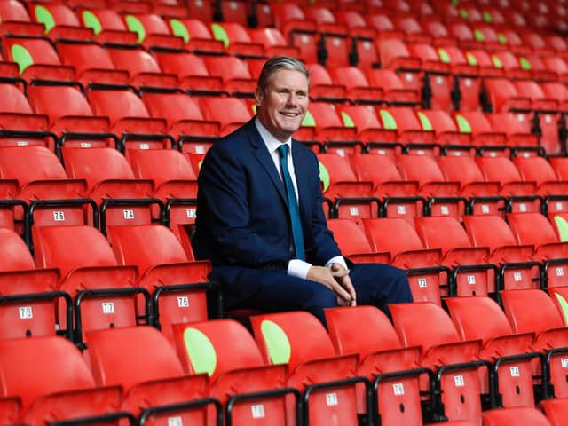 Labour Leader Keir Starmer sits in social distanced seating during a visit of Walsall Football Club on September 19, 2020 in Walsall, England.