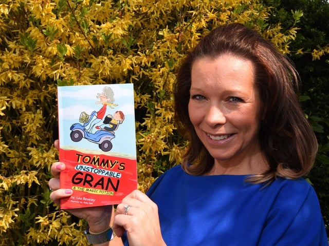 Lea Reveley with her book