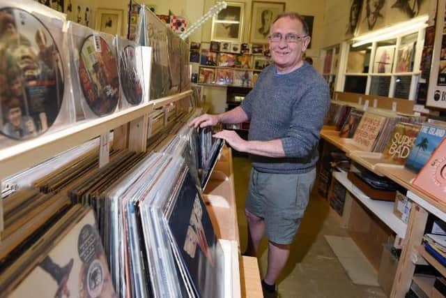 Peter Thompson in his Vinyl record store