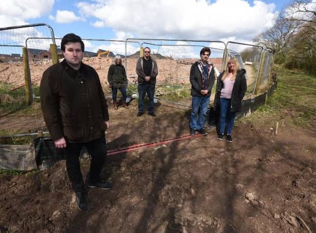 Residents, from left, Adam Marsh, Jo Gregory, Stuart McGivern, Martin Kinsella and Andrea Kinsella angered by the path closure