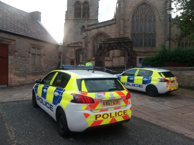 Police at the scene of Wigan Parish Church in August 2020