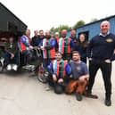 George Melling, in the rickshaw, with staff at Global Engineering who are preparing to travel 36 miles to Blackpool