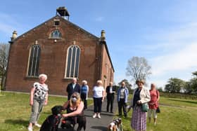 Congregation members outside the church