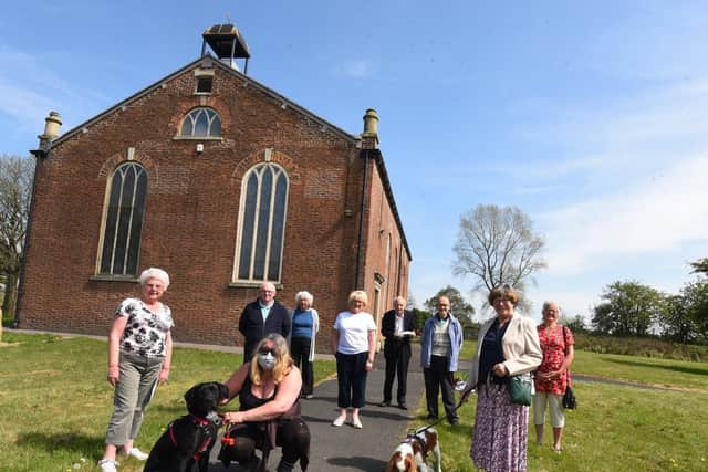 Congregation members outside the church