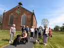 Congregation members outside the church