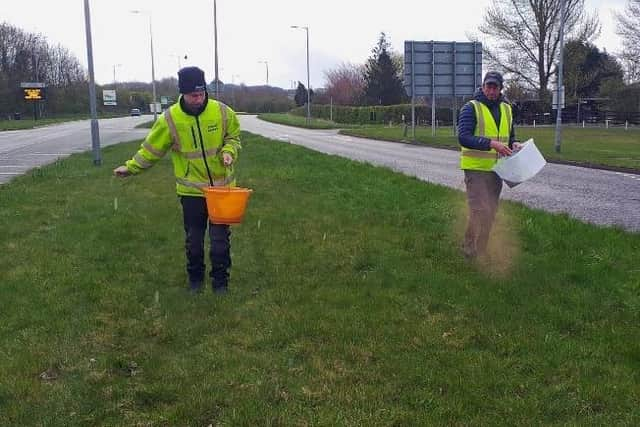 Ron Wade (pictured right) with Kieran Sayer from Wigan Council seeding the grassed area in Standish