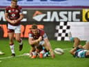 Jackson Hastings celebrates his opening try