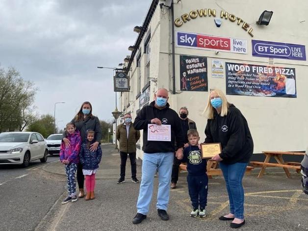 Lynn and Steve Salter (front) with councillors Chris Ready and Ron Conway (back) and community officer Laura Flynn outside The Crown Hotel