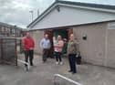 Coun Steve Jones (first left) with volunteers outside the new community centre