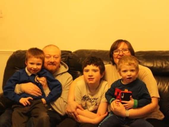 Dad  Andrew Perry  with sons Tom, Archie (centre) and Jack, and mum Louise