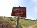 A sign for walkers on the land