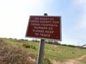 A sign for walkers on the land