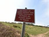 A sign for walkers on the land