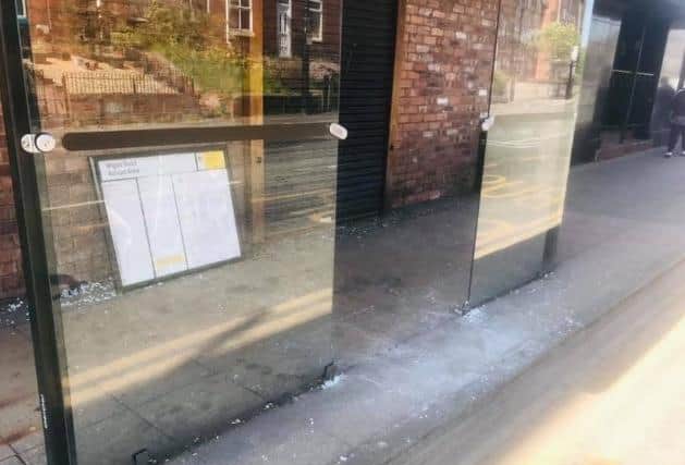 Damage caused to a bus shelter in Ashton town centre