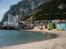 A man swims in Catalan Bay beach in Gibraltar