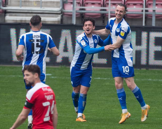 Zach Clough celebrates scoring the fourth of seven goals at the DW