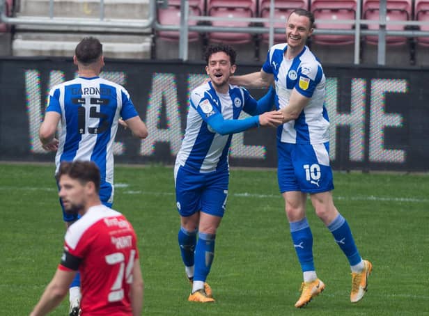 Zach Clough celebrates scoring the fourth of seven goals at the DW