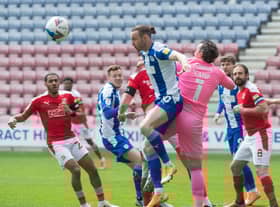 Will Keane heads for goal against Swindon