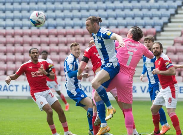 Will Keane heads for goal against Swindon