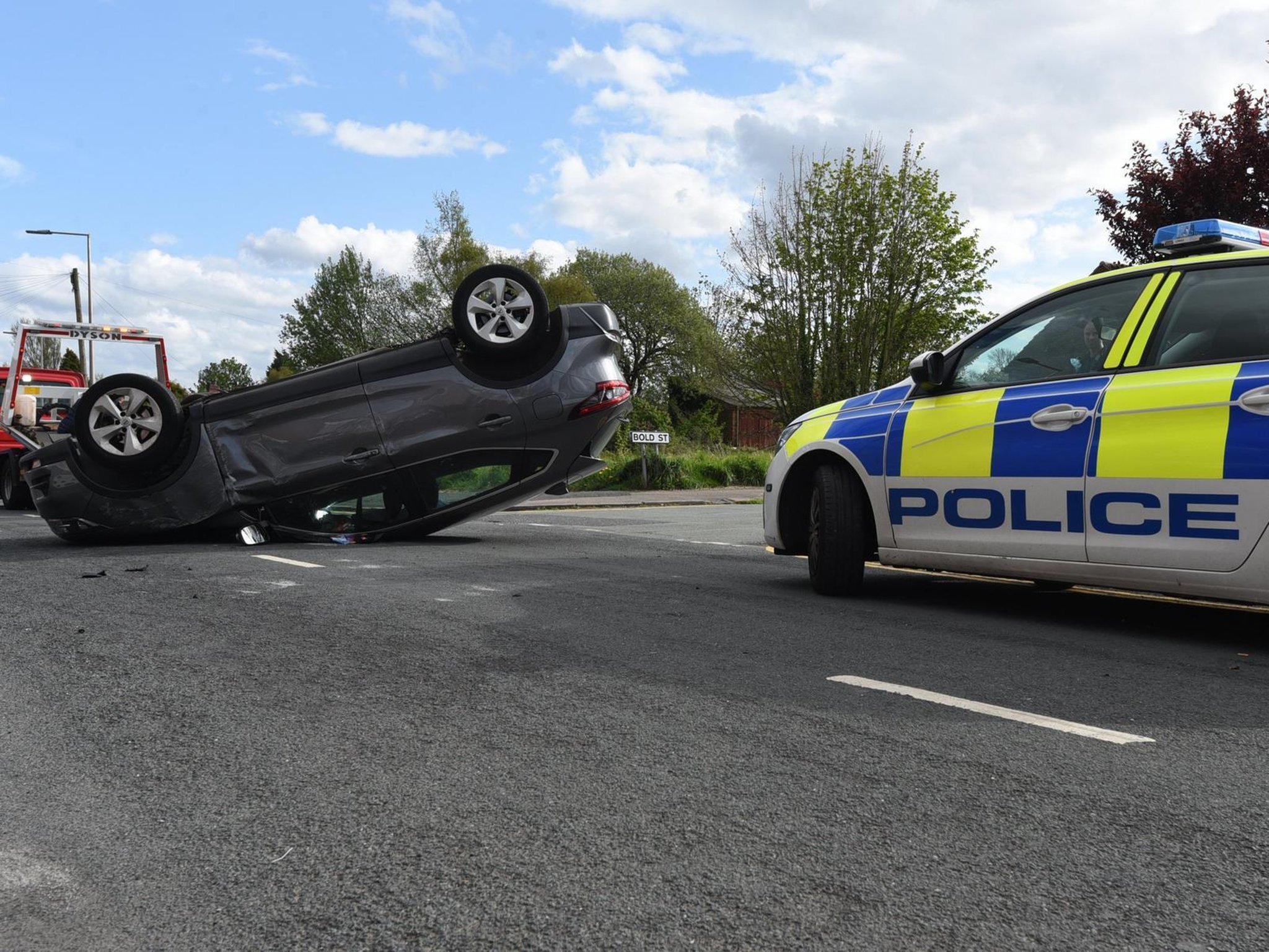 Driver walks away from overturned car after terrifying Wigan crash ...