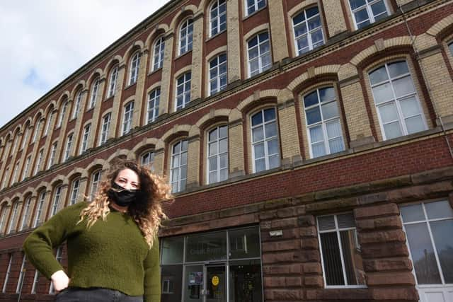 Jess Heyes, a learning support officer, outside Coops Foyer