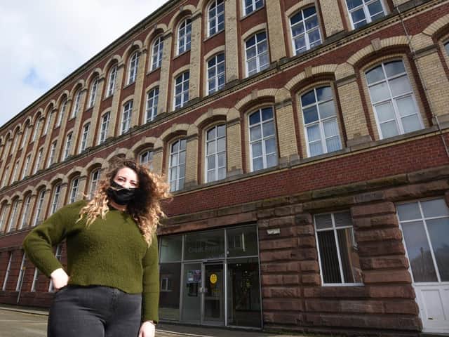 Jess Heyes, a learning support officer, outside Coops Foyer