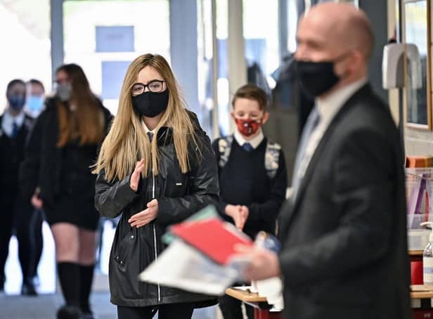 Secondary school pupils in England will no longer be required to wear face masks in class from next week