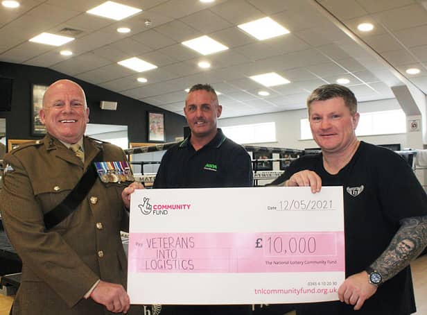 Ricky Hatton, right, presents the cheque to Wiganer Steve Eden and Major Ian Battersby, chairman of Veterans Into Logistics