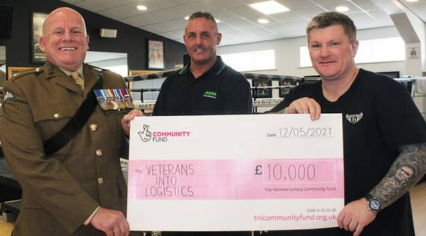 Ricky Hatton, right, presents the cheque to Wiganer Steve Eden and Major Ian Battersby, chairman of Veterans Into Logistics