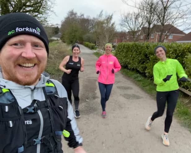 Lee Clark with running club members