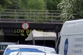 The van stuck beneath the low bridge on Prescott Street